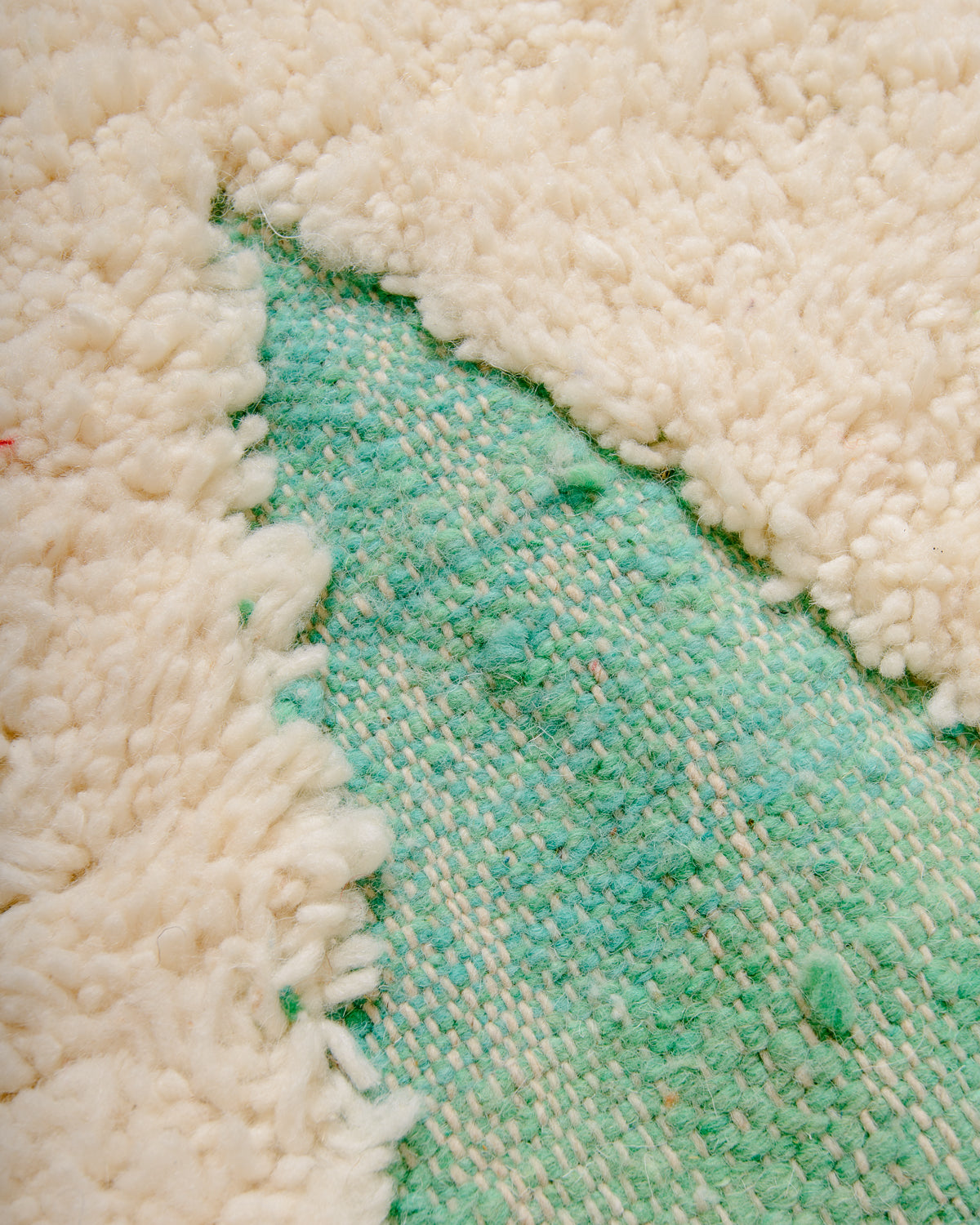 Modern, designer, handcrafted Berber rug from Morocco. Beniourain carpet with beautiful colours and patterns and fluffy wool texture.